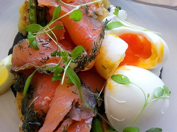 Poached Eggs on Potato & Leek Hash Cakes with Salmon Gravadlax, Chard Asparagus & Squid Ink Mayo (oozing egg)